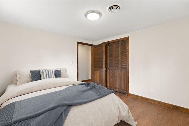 126 Prospect Hill St, Taunton, MA 02780 - bedroom with a closet, wood finished floors, and baseboards
