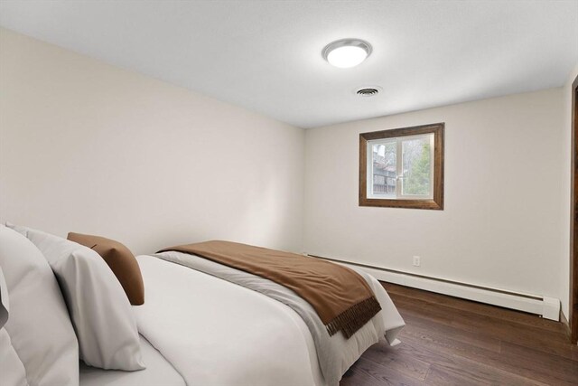 126 Prospect Hill St, Taunton, MA 02780 - bedroom featuring a baseboard radiator, wood finished floors, and baseboards