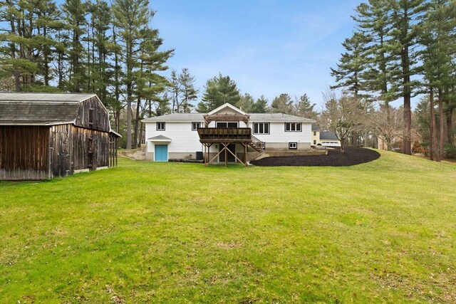 126 Prospect Hill St, Taunton, MA 02780 - rear view of house featuring a wooden deck, stairway, a lawn, and an outdoor structure