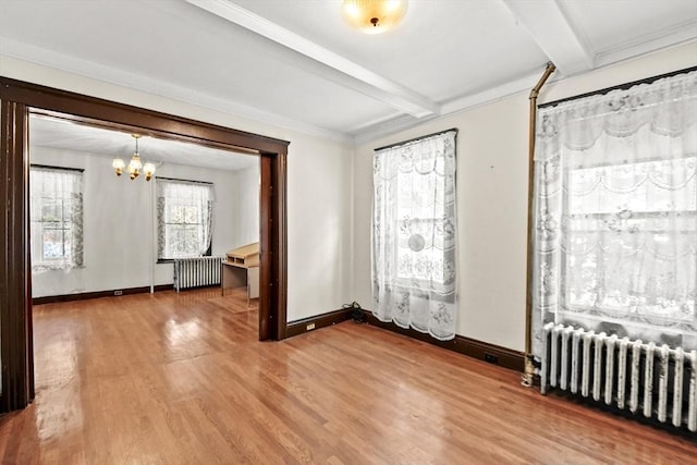 unfurnished room featuring beamed ceiling, wood-type flooring, radiator, and an inviting chandelier