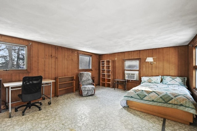 bedroom featuring cooling unit and wooden walls