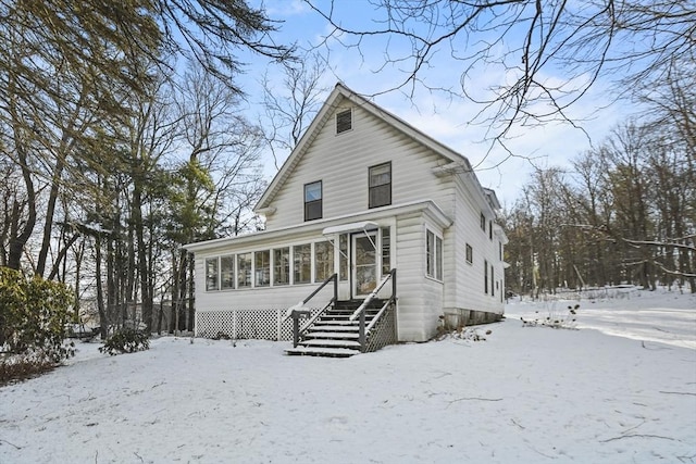 view of front facade with a sunroom