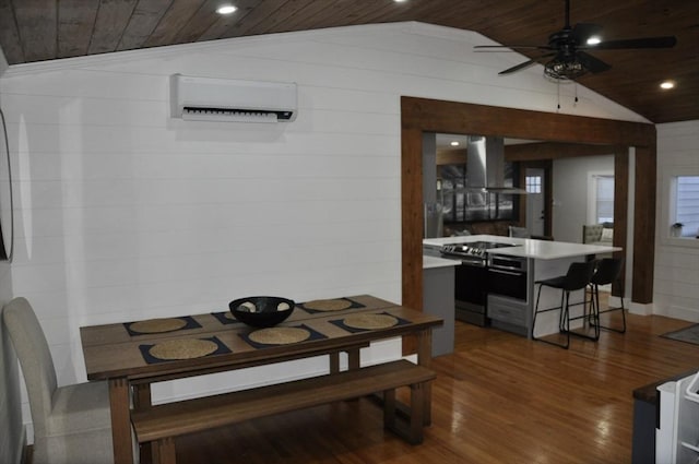 dining area featuring vaulted ceiling, wooden ceiling, and a wall unit AC