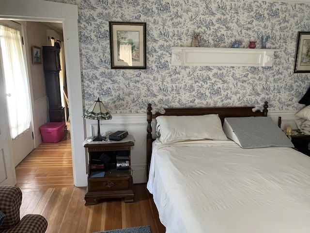 293 Washington, Warren, MA 01083 - bedroom with wallpapered walls, a wainscoted wall, and wood finished floors