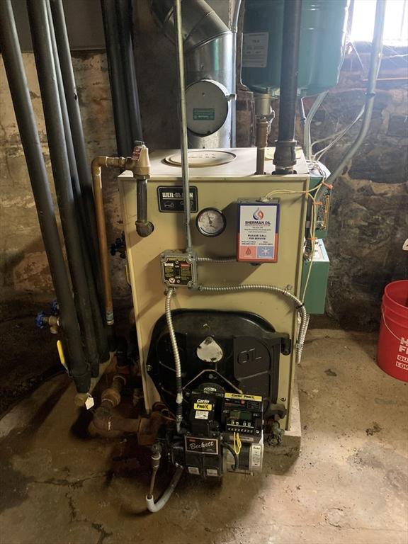 293 Washington, Warren, MA 01083 - utility room featuring a heating unit