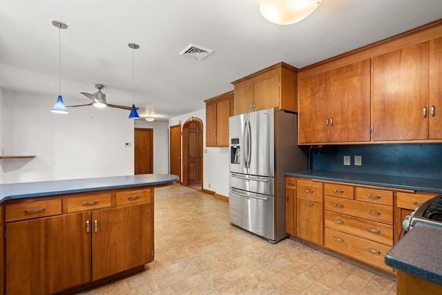 4 Farmland Rd, Saugus, MA 01906 - kitchen featuring stainless steel fridge, brown cabinets, ceiling fan, dark countertops, and hanging light fixtures