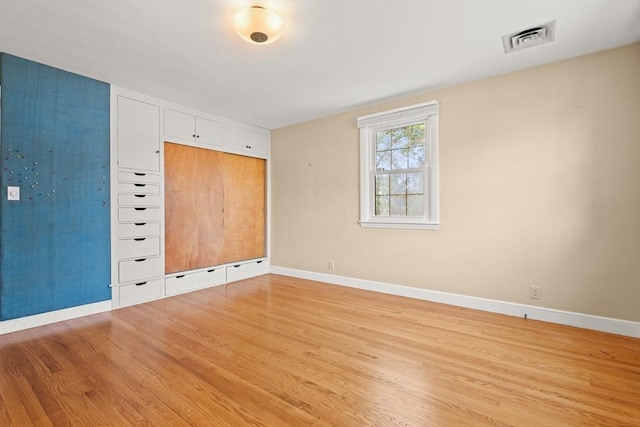 4 Farmland Rd, Saugus, MA 01906 - empty room featuring light wood-style flooring and baseboards