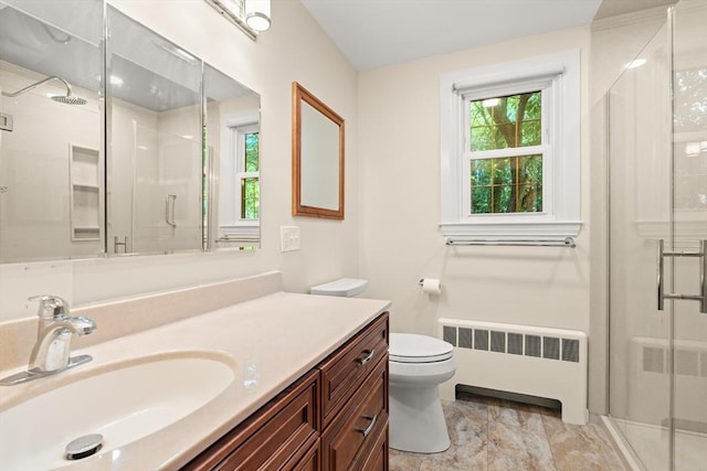4 Farmland Rd, Saugus, MA 01906 - bathroom featuring radiator heating unit, vanity, a shower stall, and toilet