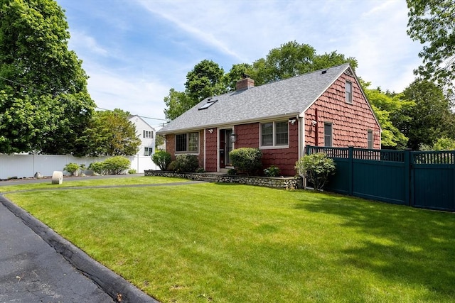 4 Farmland Rd, Saugus, MA 01906 - view of front of property with a shingled roof and a chimney