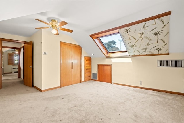 4 Farmland Rd, Saugus, MA 01906 - additional living space featuring light carpet, a skylight, lofted ceiling, baseboards, and radiator heating unit