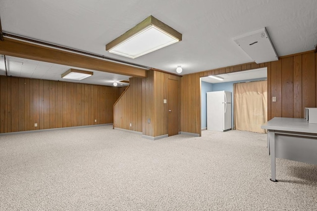 4 Farmland Rd, Saugus, MA 01906 - finished basement featuring freestanding refrigerator, wood walls, light colored carpet, stairway, and baseboards