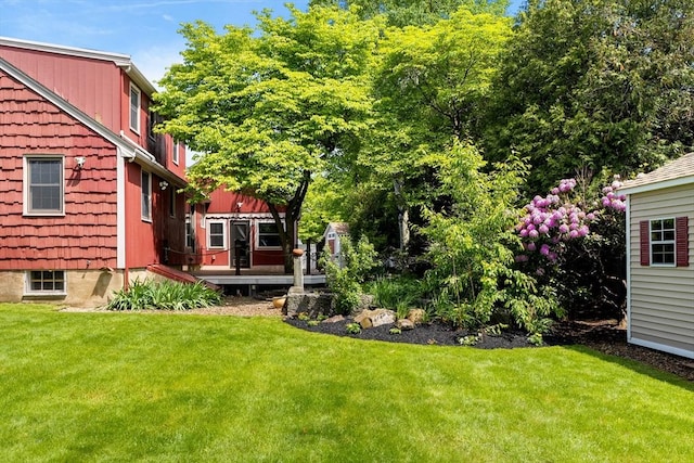 4 Farmland Rd, Saugus, MA 01906 - view of green lawn with a wooden deck