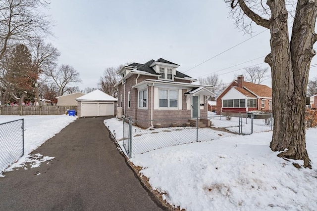 bungalow-style house with an outbuilding and a garage