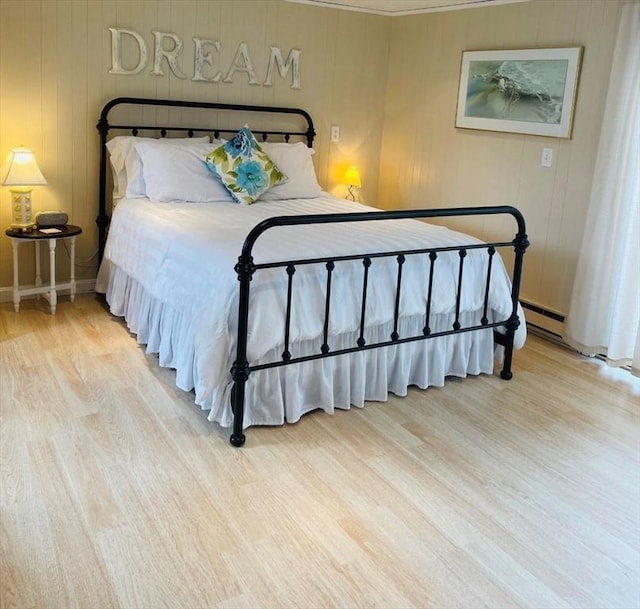 bedroom with light hardwood / wood-style flooring