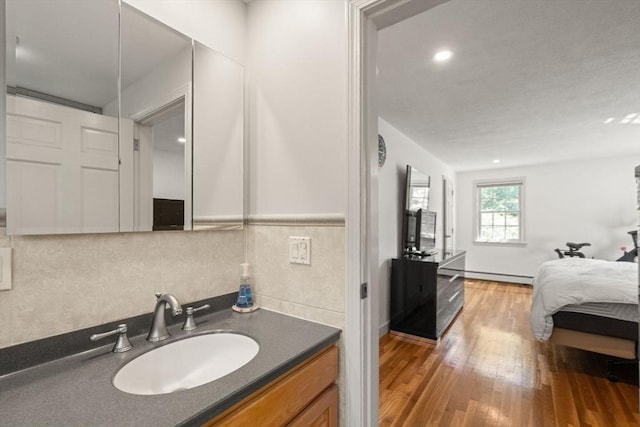 1 Pleasantview Ter, Framingham, MA 01701 - bathroom with baseboard heating, wood finished floors, and vanity