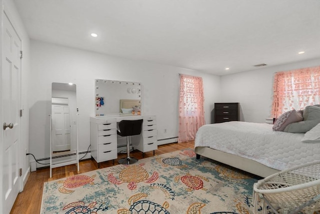1 Pleasantview Ter, Framingham, MA 01701 - bedroom featuring wood finished floors, an office area, recessed lighting, and a baseboard radiator