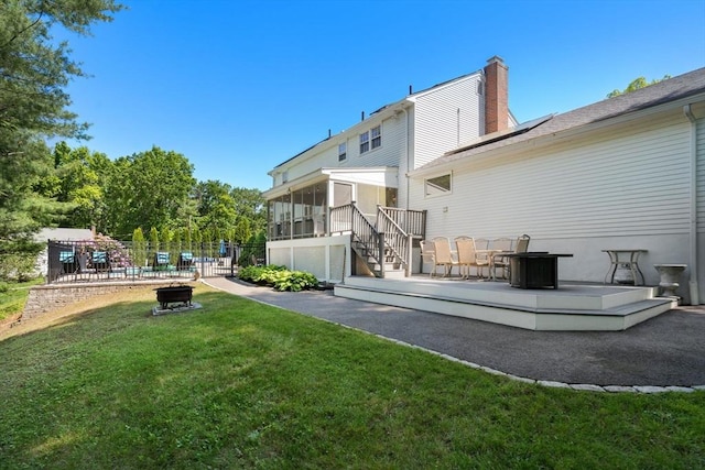 1 Pleasantview Ter, Framingham, MA 01701 - back of house with a sunroom, a chimney, a deck, and stairway