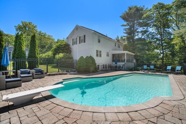 1 Pleasantview Ter, Framingham, MA 01701 - view of pool with a patio area, a diving board, a sunroom, and outdoor lounge area