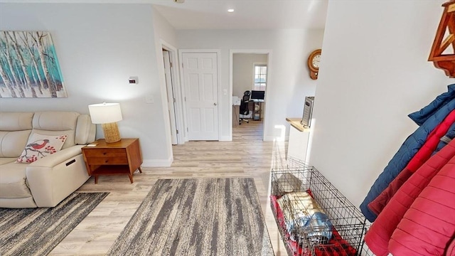 corridor with light hardwood / wood-style flooring