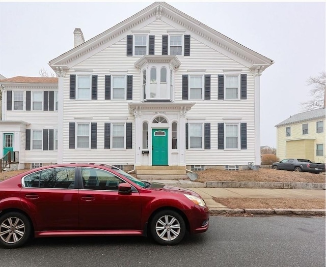 view of front of property featuring a chimney