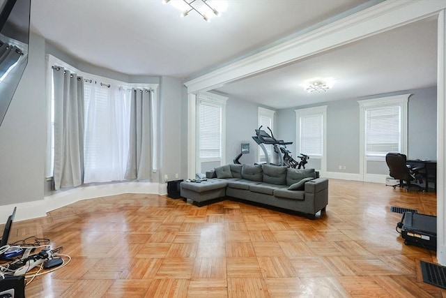 living area featuring baseboards