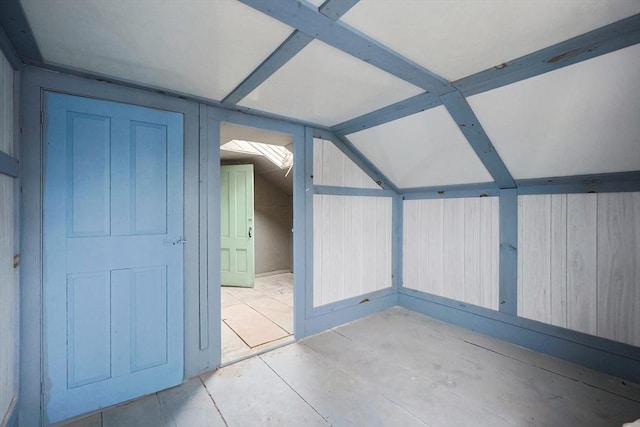 additional living space featuring lofted ceiling