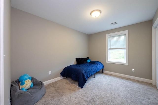 bedroom with light carpet