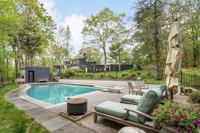 view of pool featuring a patio and fence