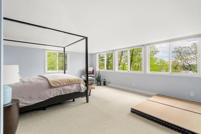 carpeted bedroom with baseboards