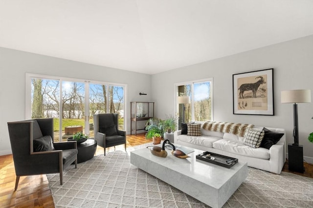 living room featuring light wood-style flooring and baseboards