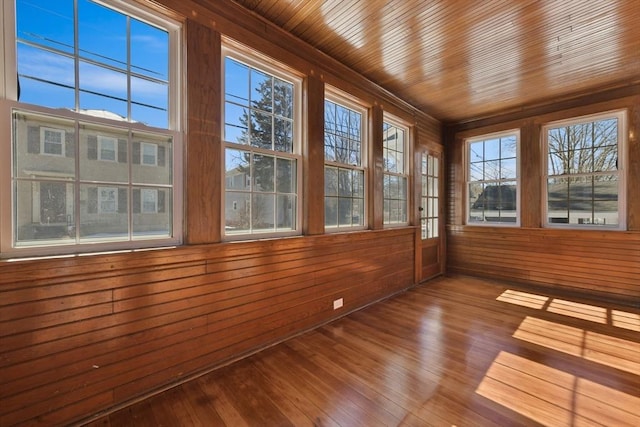 unfurnished sunroom with wooden ceiling