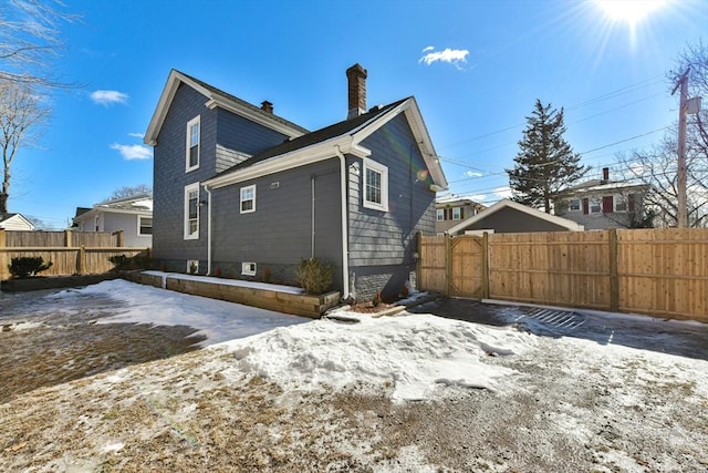 view of snow covered house