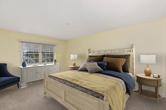 carpeted bedroom featuring baseboards