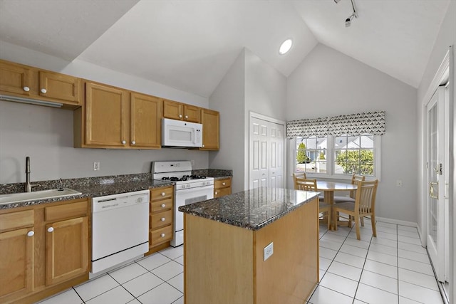 kitchen with light tile patterned floors, white appliances, high vaulted ceiling, and a sink