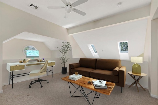 living room featuring baseboards, lofted ceiling with skylight, carpet flooring, and visible vents