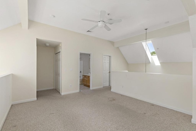 bonus room featuring baseboards, lofted ceiling with skylight, visible vents, and carpet floors