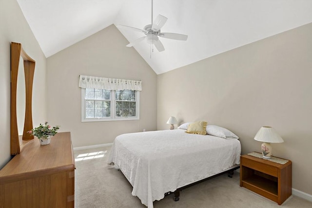 carpeted bedroom featuring lofted ceiling, baseboards, and a ceiling fan