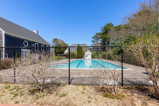 community pool featuring fence