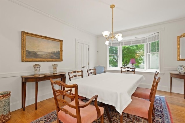 210 Melrose St, Newton, MA 02466 - dining room featuring light wood-type flooring, ornamental molding, a chandelier, and baseboards