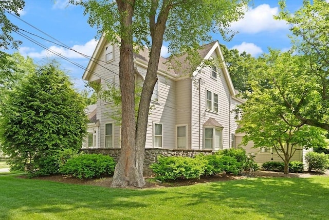 210 Melrose St, Newton, MA 02466 - view of side of home with a lawn and stone siding