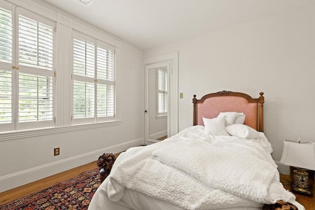 210 Melrose St, Newton, MA 02466 - bedroom with baseboards and wood finished floors