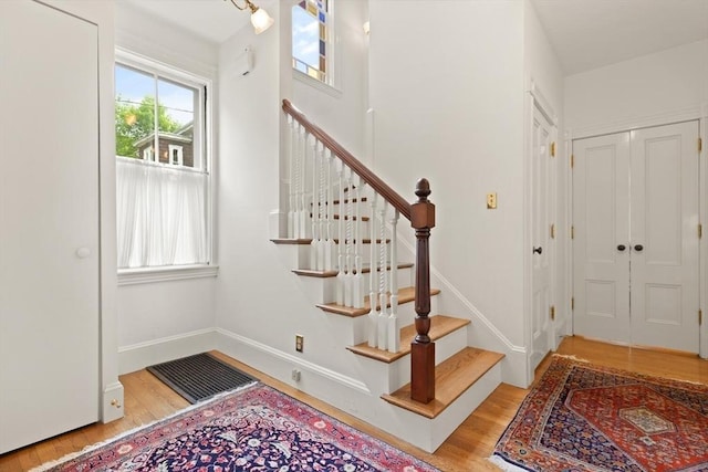 210 Melrose St, Newton, MA 02466 - entrance foyer with wood finished floors, stairway, and baseboards