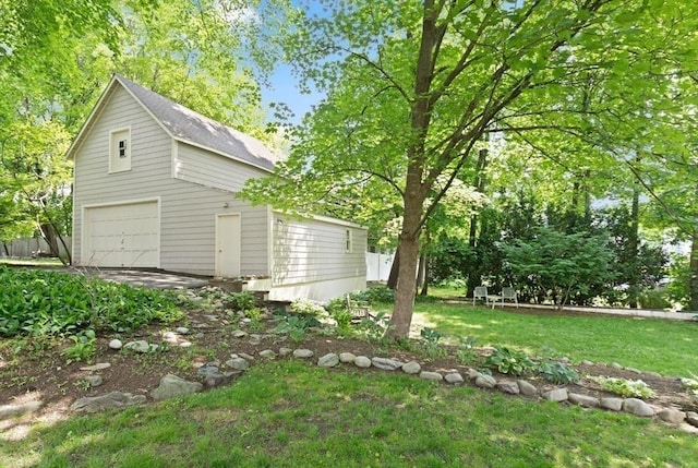 210 Melrose St, Newton, MA 02466 - view of grassy yard featuring a garage and an outbuilding