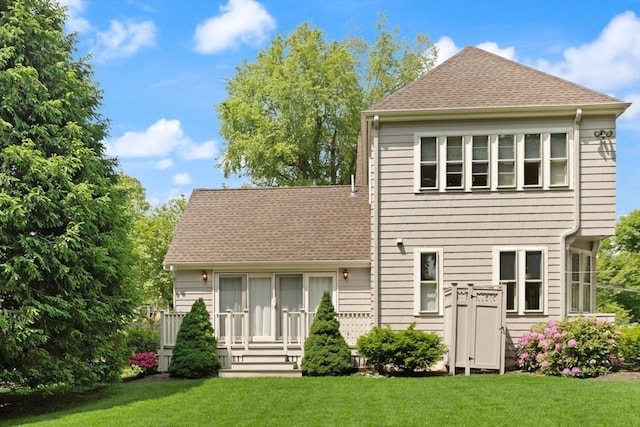 210 Melrose St, Newton, MA 02466 - back of house with a yard and roof with shingles