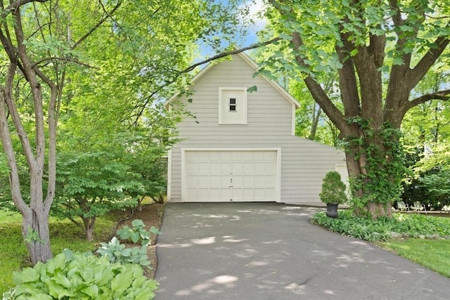 210 Melrose St, Newton, MA 02466 - view of side of property with a detached garage and driveway