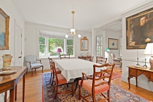 210 Melrose St, Newton, MA 02466 - dining area with light wood finished floors, ornamental molding, and baseboards