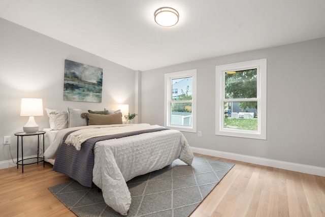 bedroom with hardwood / wood-style flooring