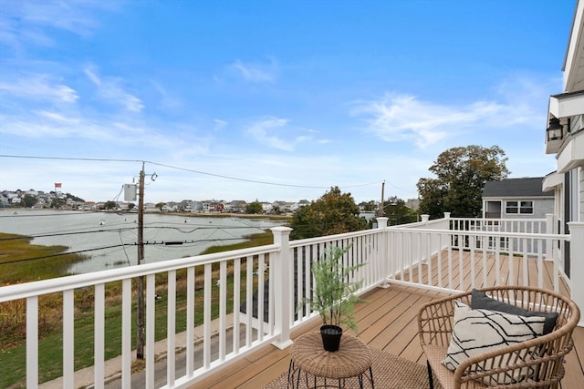 deck featuring a water view