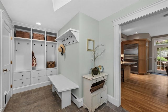 mudroom featuring a baseboard radiator, recessed lighting, baseboards, and dark wood finished floors
