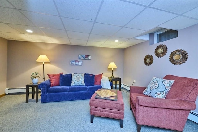 carpeted living room featuring a paneled ceiling, baseboards, recessed lighting, and a baseboard radiator